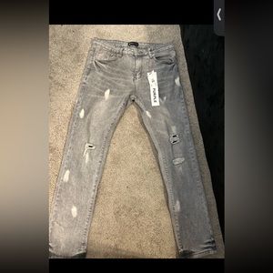 Purple jeans men’s size 32 has tags , back tag is kinda from washing machine